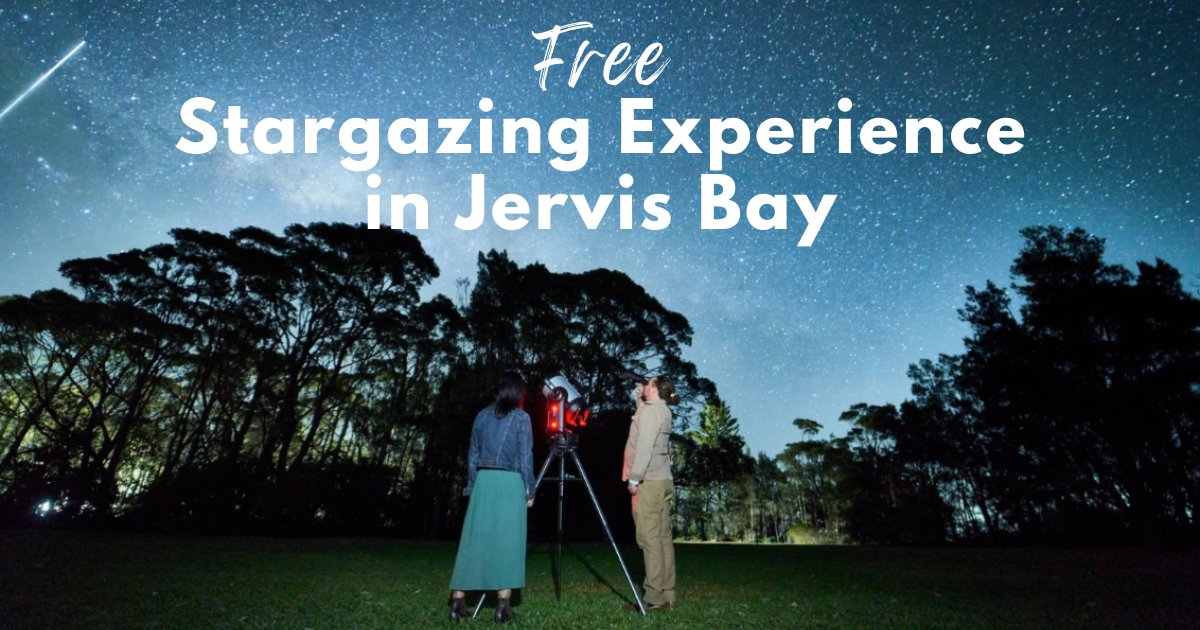 Couple stargazing through a telescope under a clear, starry night sky in Jervis Bay.