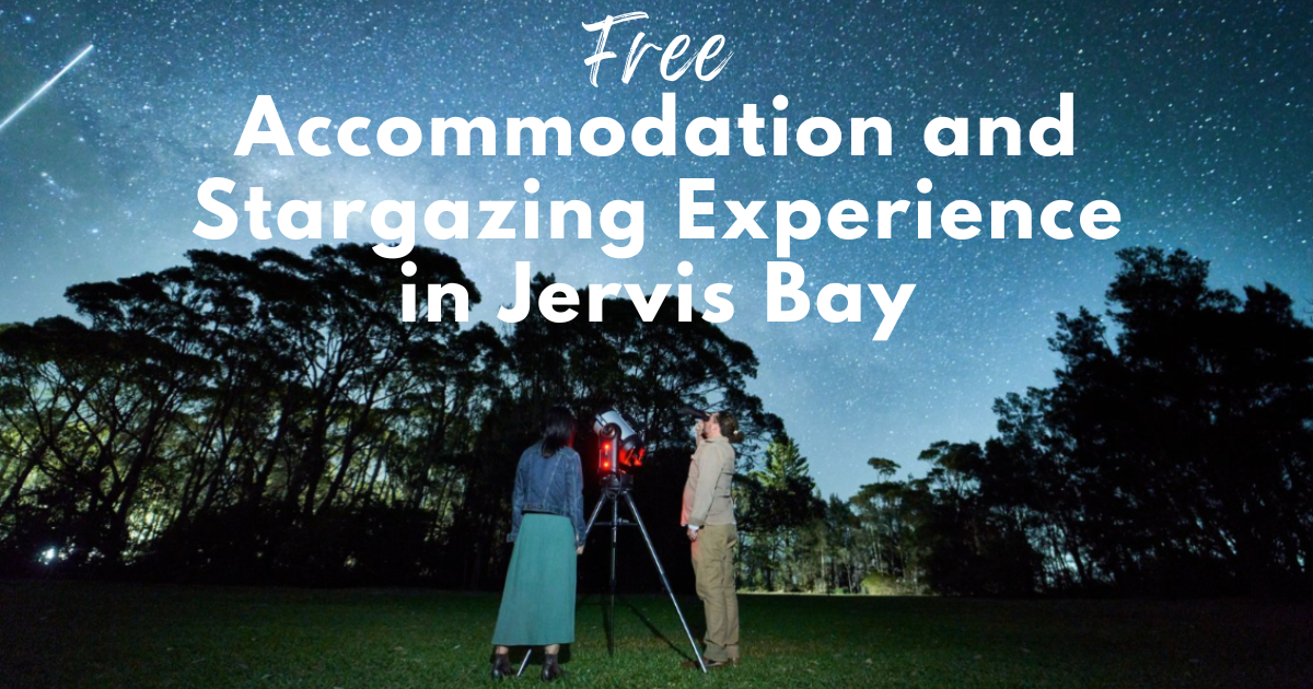 Couple stargazing through a telescope under a clear, starry night sky in Jervis Bay.