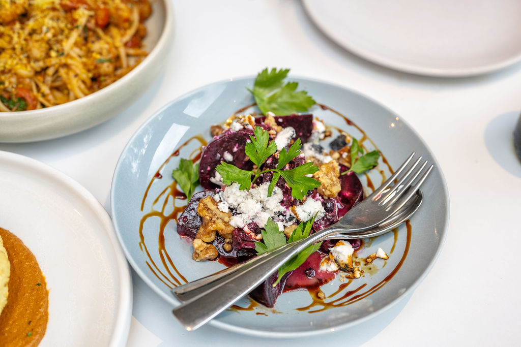 Plate of beetroot salad with feta and walnuts, part of the Shoalhaven's culinary offerings.