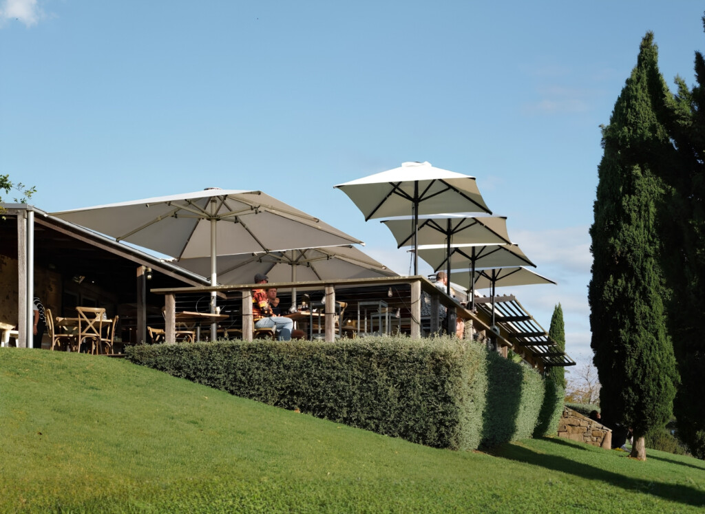 Outdoor terrace at Cupitt's Estate overlooking rolling countryside during an afternoon gathering near Jervis Bay.