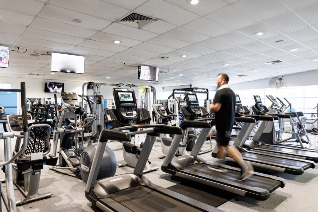 Cardio fitness equipment including treadmills and exercise machines in an indoor gym