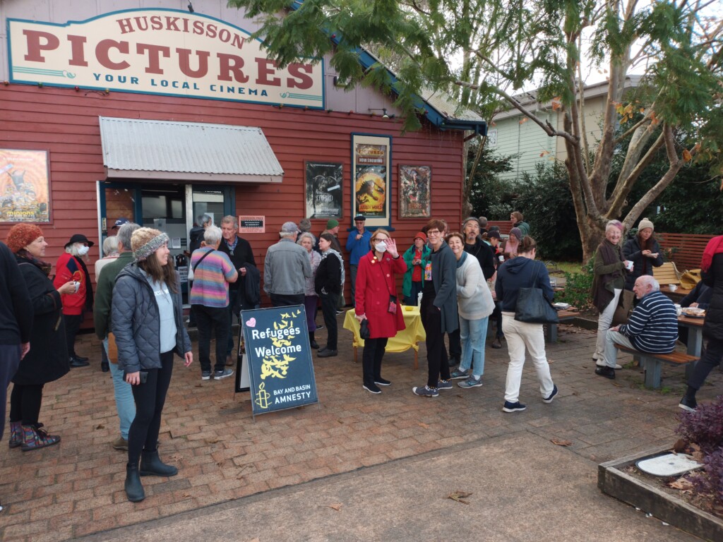 Huskisson Pictures local cinema with visitors gathered outside for a community event