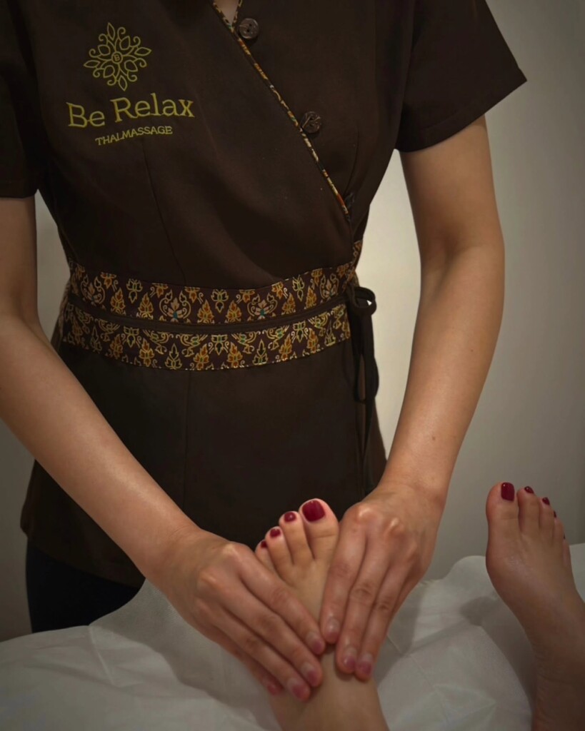 Therapist providing a relaxing foot massage at Be Relax Thai Massage